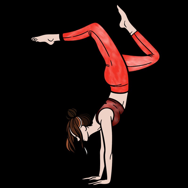a woman doing a handstand