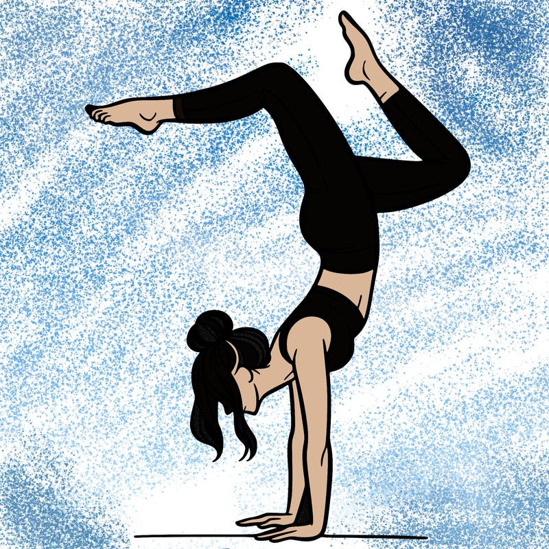 a woman doing a handstand
