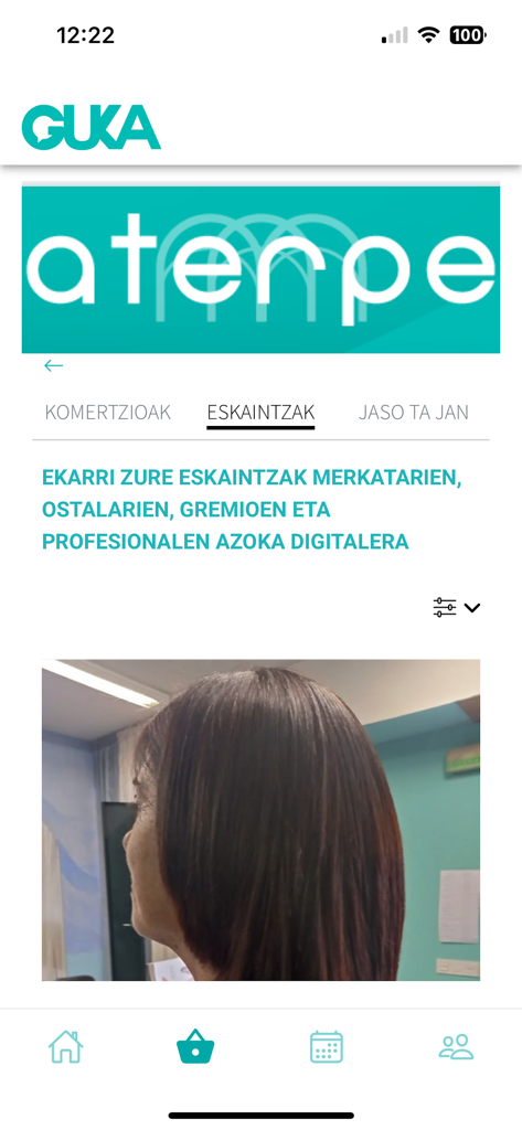 Pantalla de la aplicación Guka mostrando la sección Aterpe con ofertas de comerciantes locales y una interfaz de mercado digital.