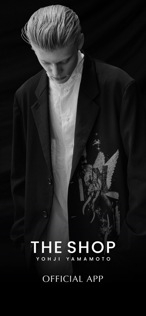 THE SHOP YOHJI YAMAMOTO - Monochrome splash screen for THE SHOP YOHJI YAMAMOTO official app featuring a model in avant-garde fashion