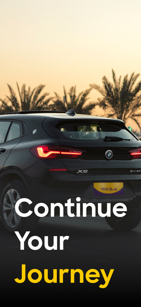 Rear view of a black BMW SUV rental car under palm trees with text Continue Your Journey