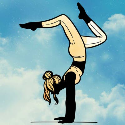 a woman doing a handstand