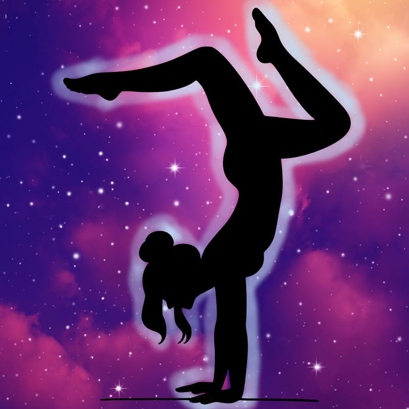 a woman doing a handstand