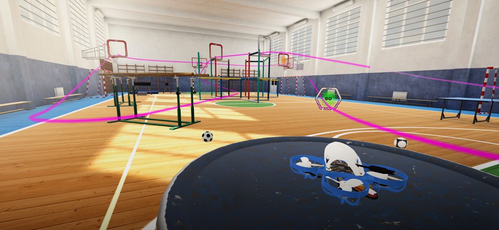 A micro drone sits on a landing pad in a gymnasium racing course with a pink flight path and obstacles.