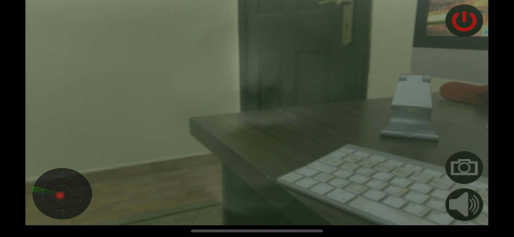 رادار الاشباح - A screenshot of the Ghost Radar app interface showing an augmented reality camera view with a radar scanner and control buttons