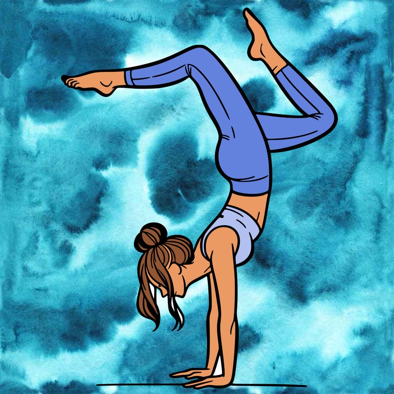 a woman doing a handstand