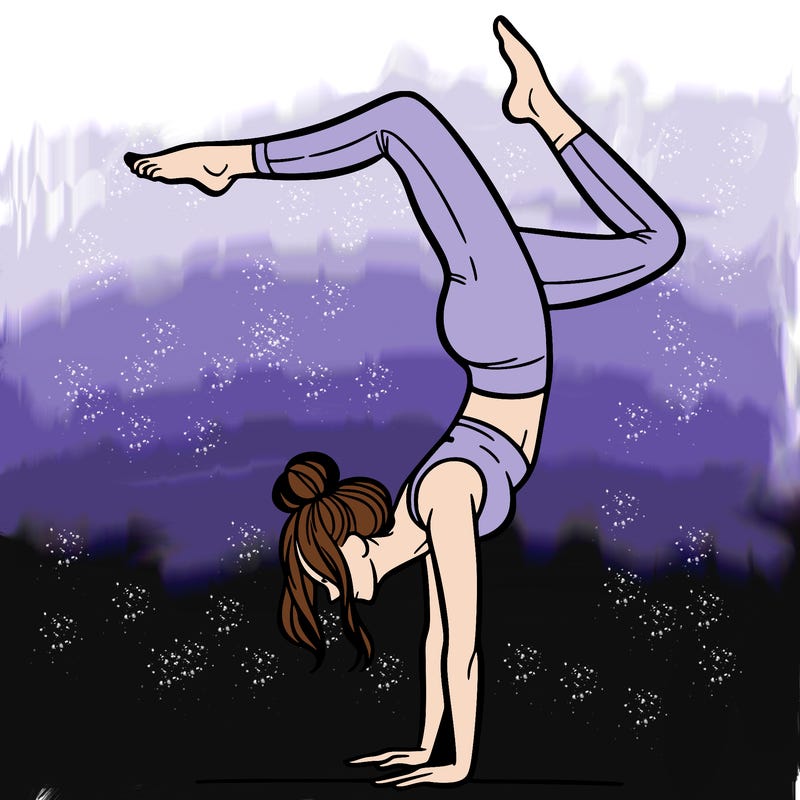 a woman doing a handstand