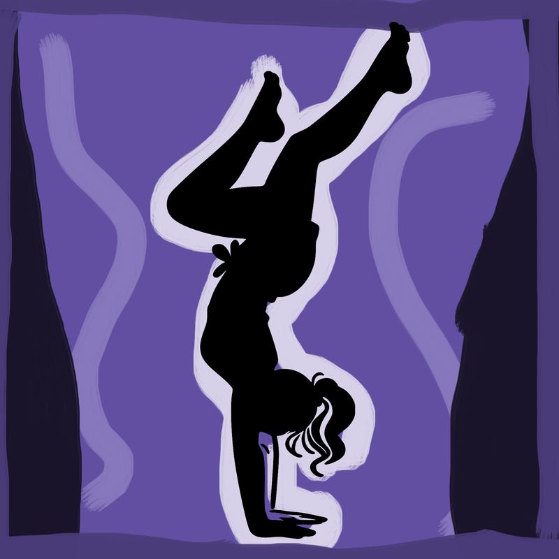 woman doing a hand stand