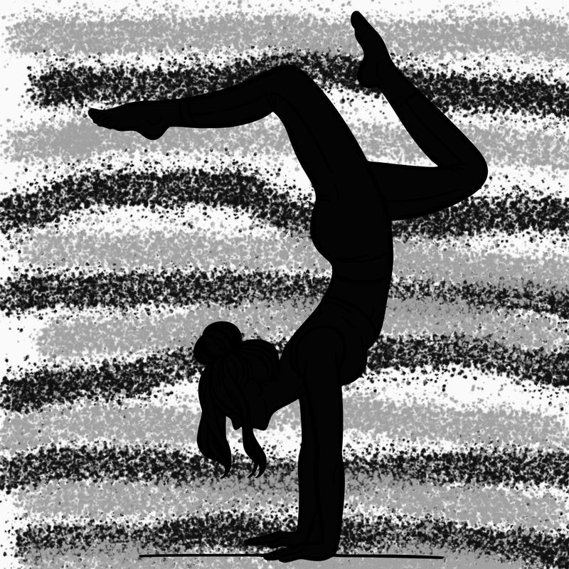 a woman doing a handstand