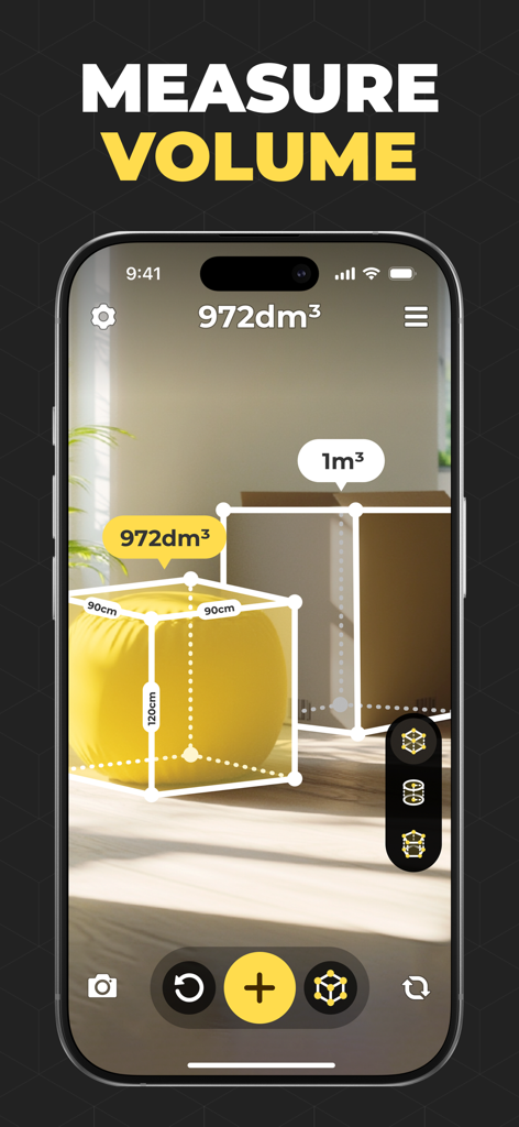 iPhone screen showing an augmented reality app measuring the volume of a beanbag and a cardboard box in a room