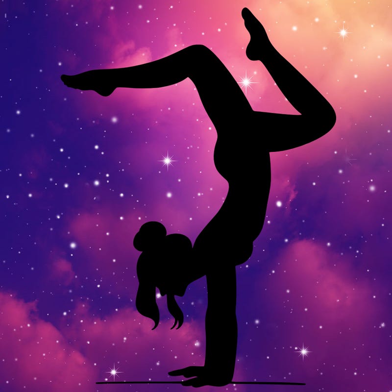 a woman doing a handstand