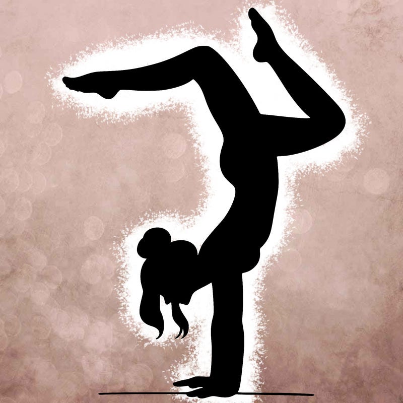 a woman doing a handstand