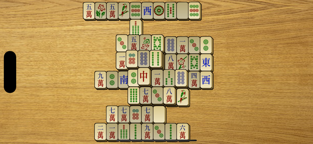 Gameplay screenshot of Mahjong Classic showing large tiles on a wooden table