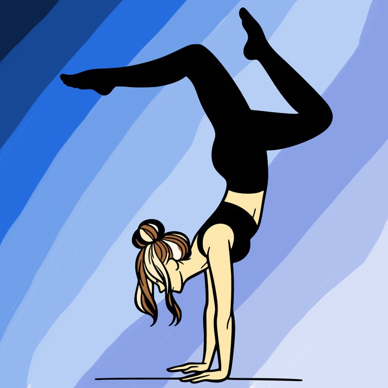 a woman doing a handstand