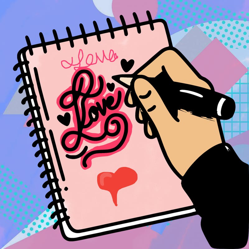 a hand writing “love” in calligraphy on a notebook