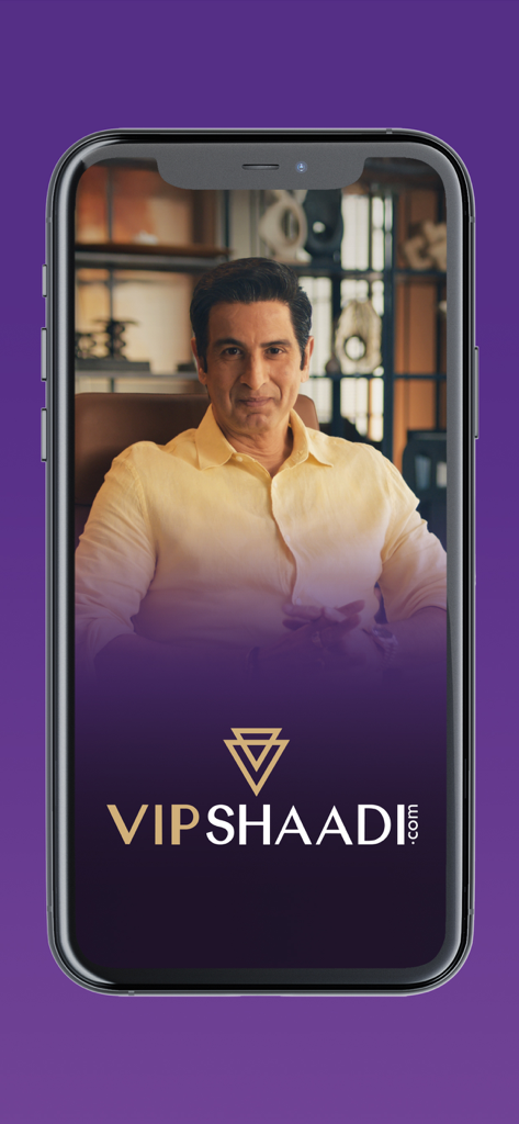 Smartphone displaying the VIPShaadi elite matchmaking app welcome screen with a professional man in the background.
