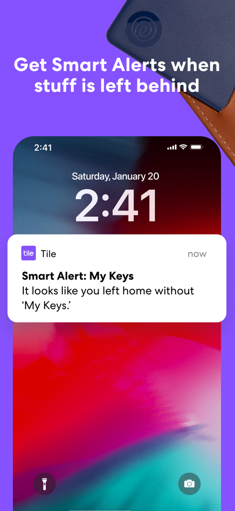 An iPhone lock screen displaying a Tile app Smart Alert notification for forgotten keys.