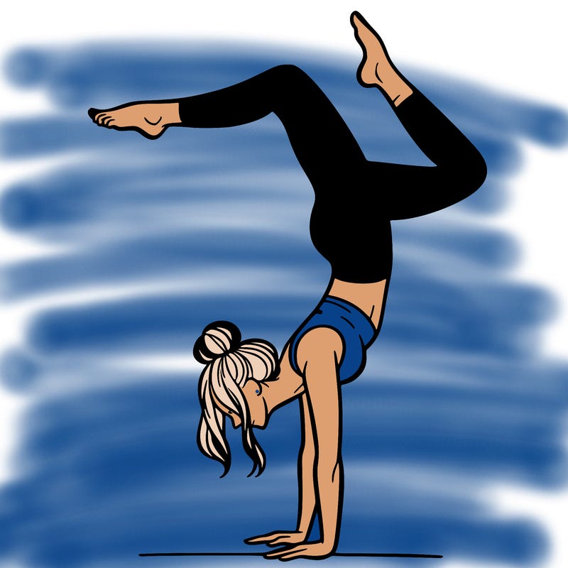 a woman doing a handstand