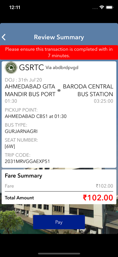 Review summary screen in the GSRTC app for a bus trip from Ahmedabad to Baroda.