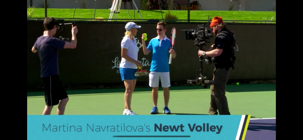 Fuzzy Yellow Balls - A video crew filming a tennis lesson with Martina Navratilova on a court.