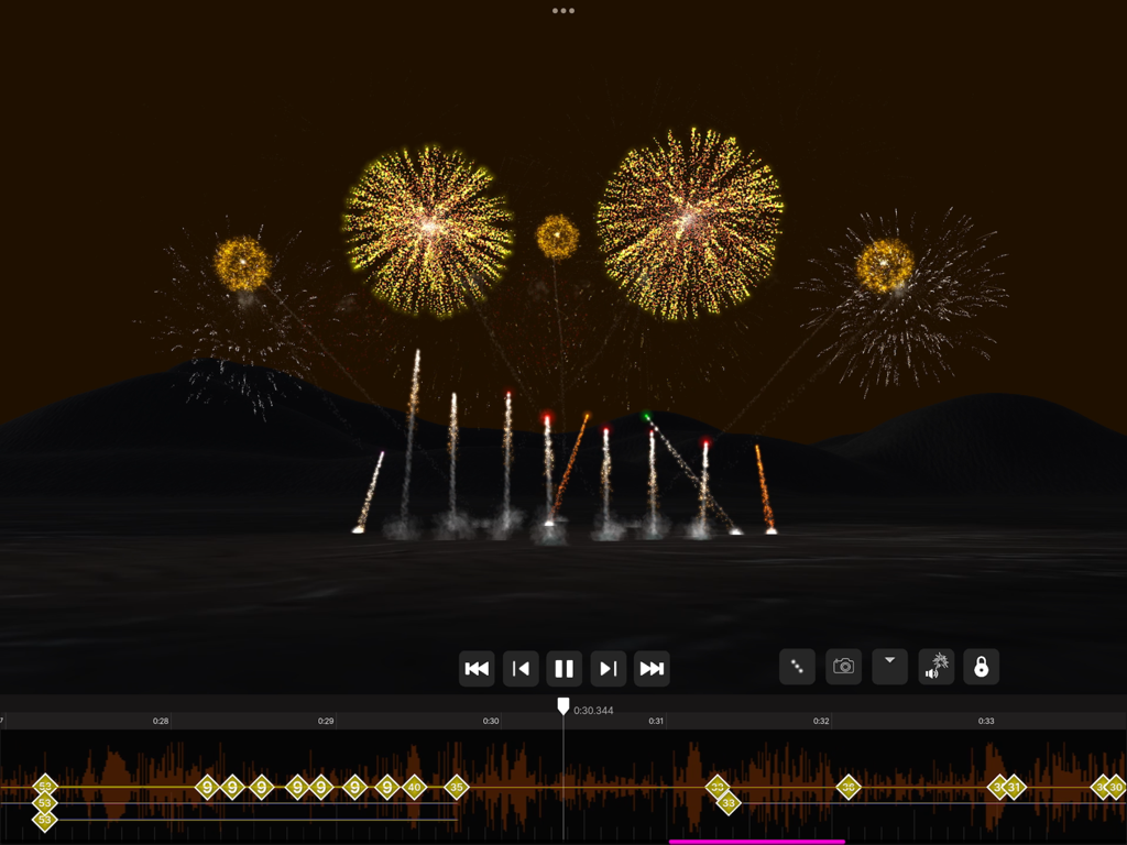 Golden fireworks display with a synchronized audio timeline in the Pyro Simulator app.