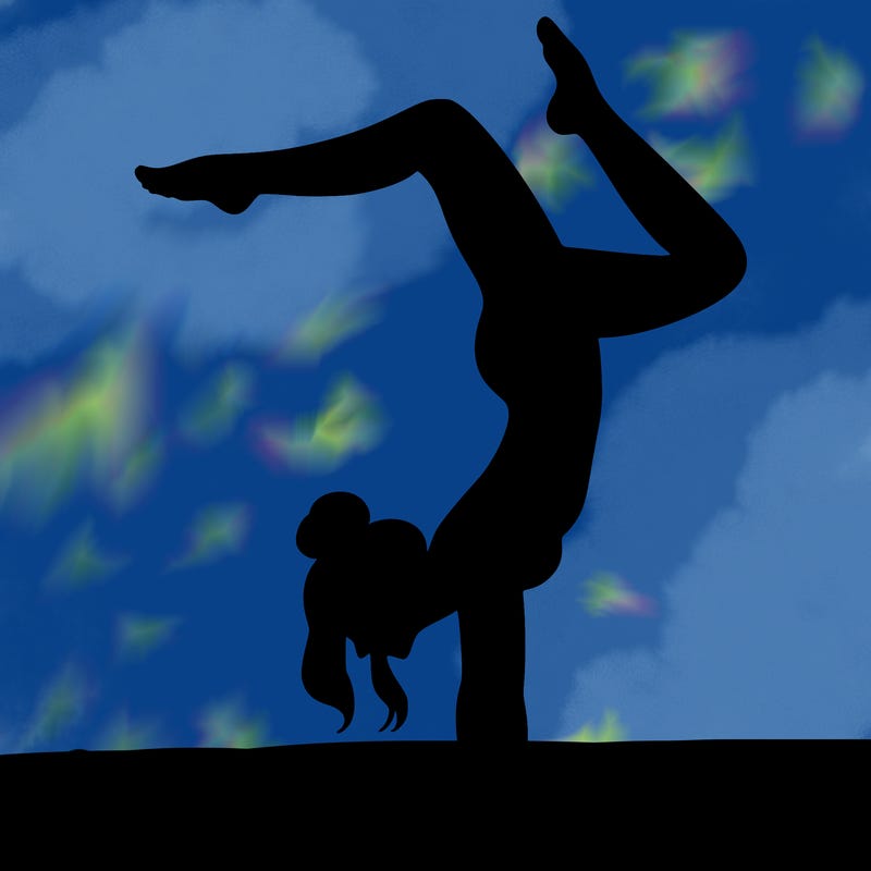 a woman doing a handstand