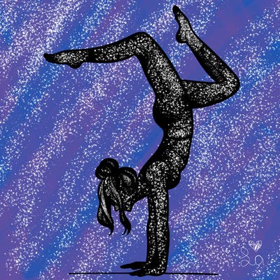 a woman doing a handstand