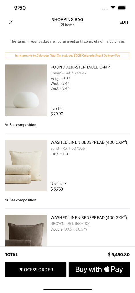 Zara Home - La pantalla de la bolsa de compras de la app Zara Home mostrando una lámpara de mesa redonda y cubrecamas de lino.