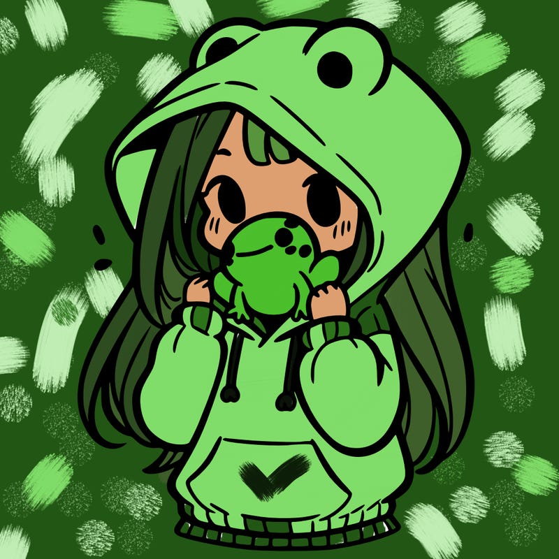 a girl holding a froggy hoodie
