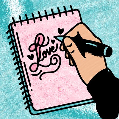 a hand writing “love” in calligraphy on a notebook