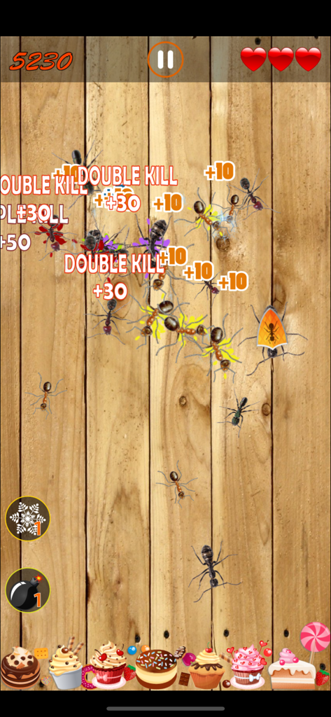 Ant Smasher - Kill Them All - Gameplay screenshot of Ant Smasher showing ants being crushed for double kill points over a wooden surface with desserts at the bottom.