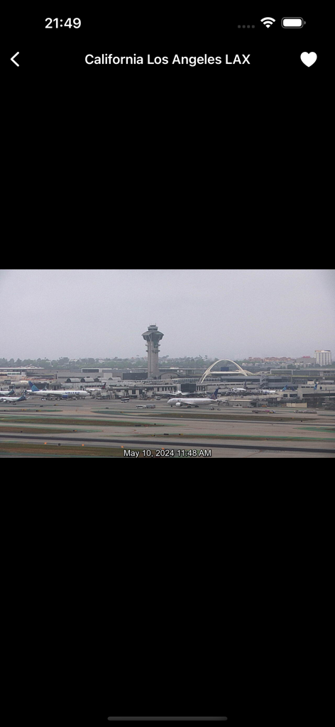 Live webcam feed of Los Angeles International Airport LAX showing airplanes and the control tower