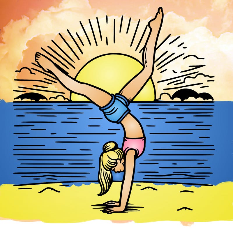 girl doing handstand infront of a sunset