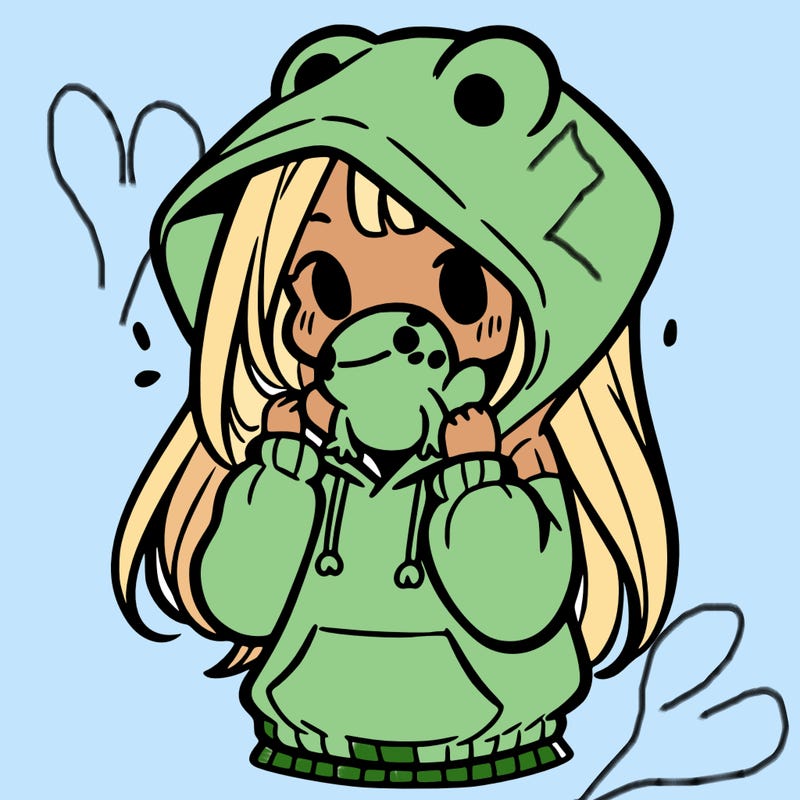 a girl holding a froggy hoodie