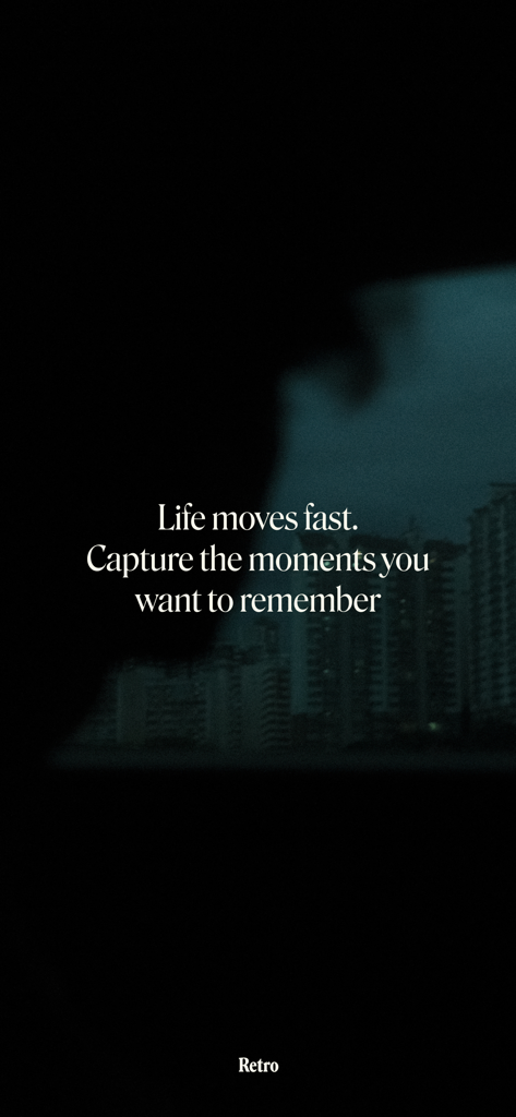 Inspirational text on Retro app about capturing life moments over a dark urban silhouette