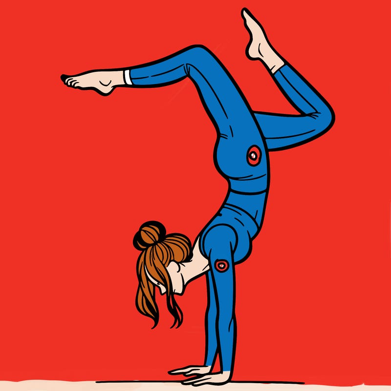 a woman doing a handstand