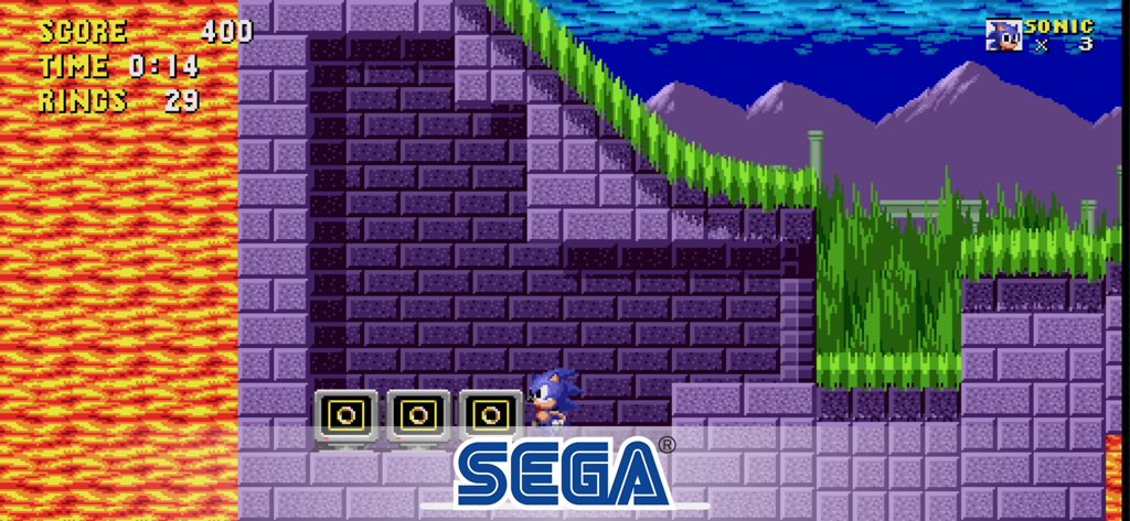 Sonic the Hedgehog standing in the Marble Zone next to three ring monitors with a SEGA logo overlay