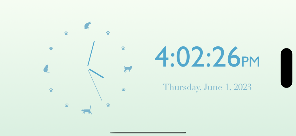 Vista horizontal de la aplicación Alarma y Temporizador con un reloj digital y un reloj analógico personalizado con siluetas de gatos y huellas de patas