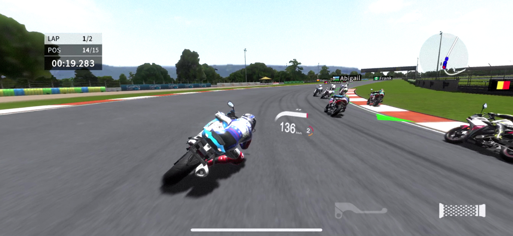 Real Moto 2 - A motorcycle racer leaning into a turn on a racing track in Real Moto 2 gameplay