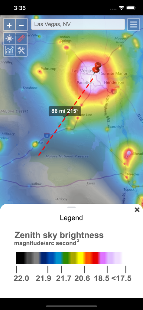 A light pollution map of the Las Vegas area showing Zenith sky brightness levels with a distance measurement tool pointing towards Mojave National Preserve.