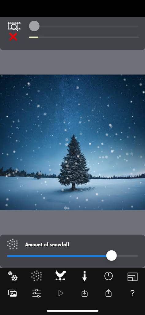 Snow Effect Video - 冬の木立の画像に降雪量を調整するスライダーを示すスノーエフェクトビデオアプリのインターフェース