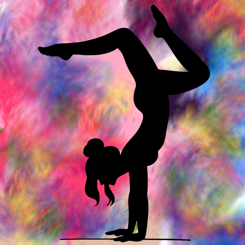 a woman doing a handstand