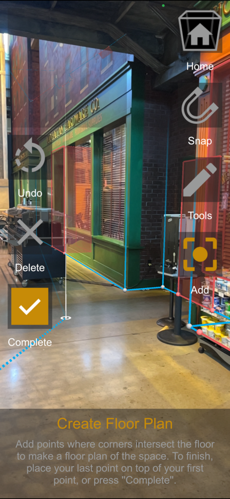 A3d Scanner 앱의 AR 인터페이스가 실제 방의 디지털 점과 선을 사용하여 평면도를 매핑하고 있습니다.