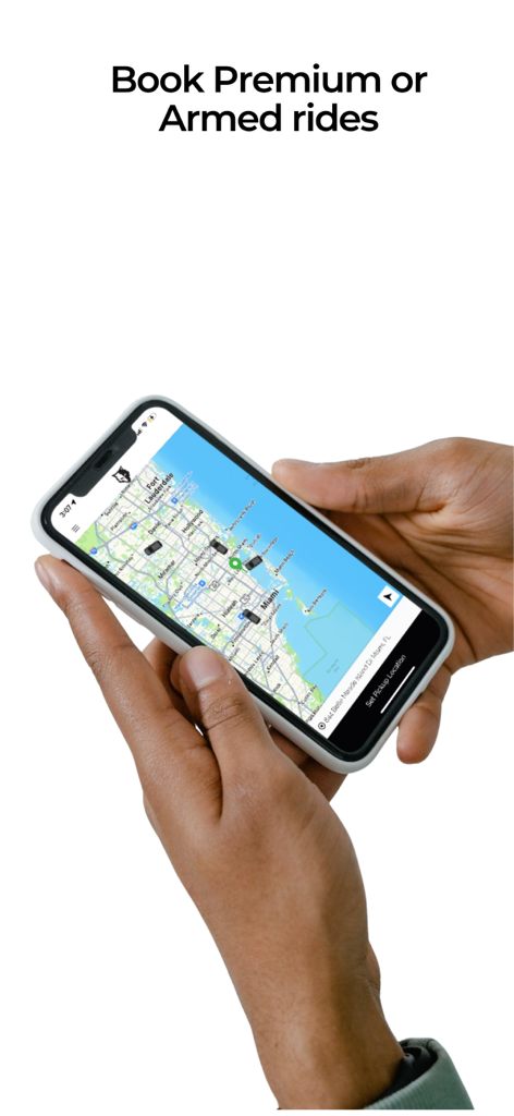 BlackWolf App - Hand holding a phone with the BlackWolf app interface showing a map to book premium or armed rides.