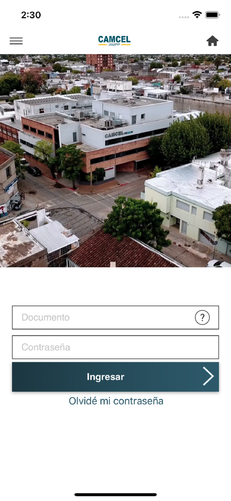 CAMCEL - Ecrã de login da app móvel CAMCEL com uma foto do centro médico e campos de entrada em espanhol para documento e palavra-passe