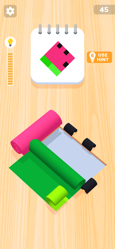 Color Roll 3D: Puzzle Art Game - Color Roll 3Dモバイルゲームのレベル、木製の背景にピンクと緑のカラーロール