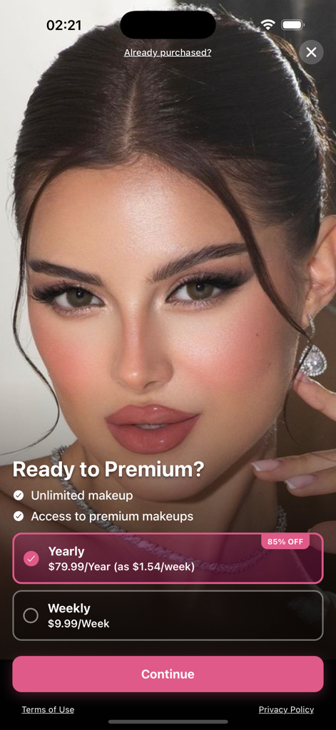 GlowAI AI Makeup app premium subscription screen showing yearly and weekly pricing plans with a glamorous makeup look