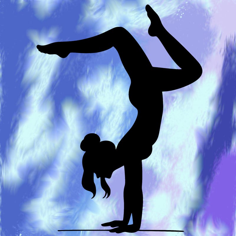 a woman doing a handstand