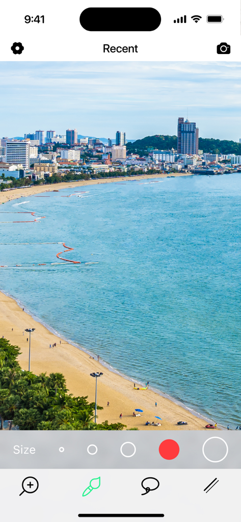 Interfaz de usuario de la aplicación Eliminar Objetos Borrador de Fotos IA que muestra un paisaje de playa y herramientas de edición