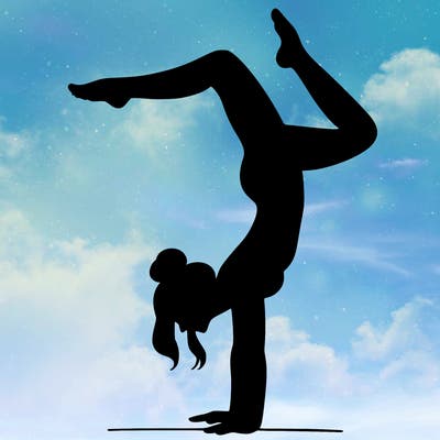 a woman doing a handstand